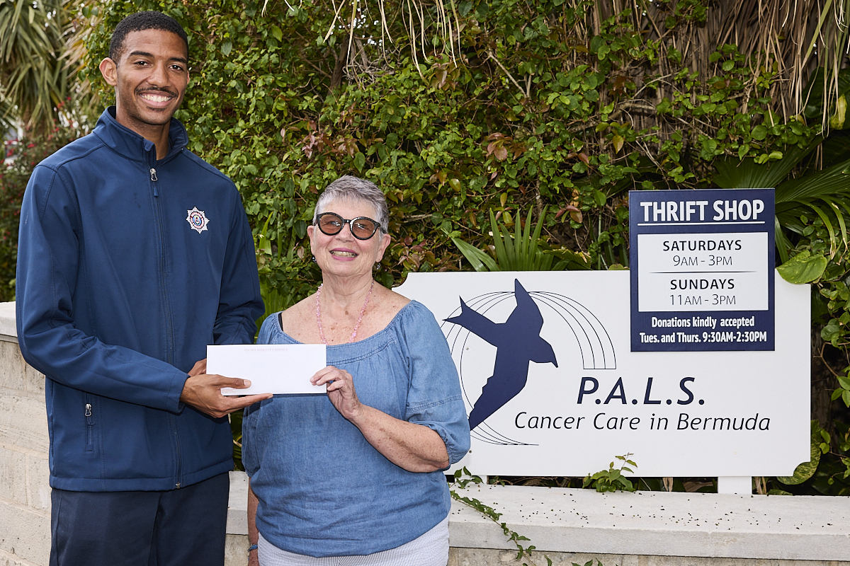 Firefighter Amaury Majors Presenting the cheque to Cancer Care Charity PALS