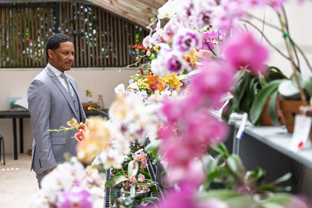 The Hon. Minister Jache Adams, JP, MP, tours the interior of the Commercial Slat House during his visit to the Botanical Gardens