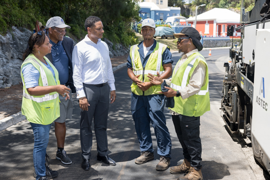 Tina Beer-Searle, Kim Swan MP, Minister Adams, Q'Shai Darrell, Skilled Labourer with the Highways Section and Nathan Darrell, Superintendent with the Highways Section.