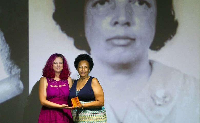 Arts Council member Hannah Collins presenting the Lifetime Achievement Award for the late Olga Simons Arts Council member Hannah Collins presenting the Lifetime Achievement Award for the late Olga Simons