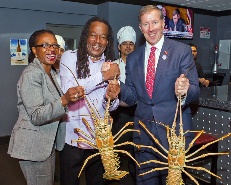 Premier Michael Dunkley and the BTA's Chief Product and Experiences Development Officer Pat Phillip-Fairn inspecting lobsters caught this morning by LITT owner and commercial fisherman Delvin Bean