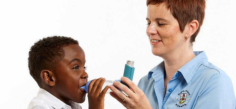PHOTO: Asthma Nurse Deann Trott demonstrates the correct use of an inhaler and spacer.