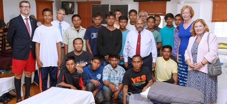 Rescued sailors with the Bermuda Minister of Tourism and the Deputy Governor